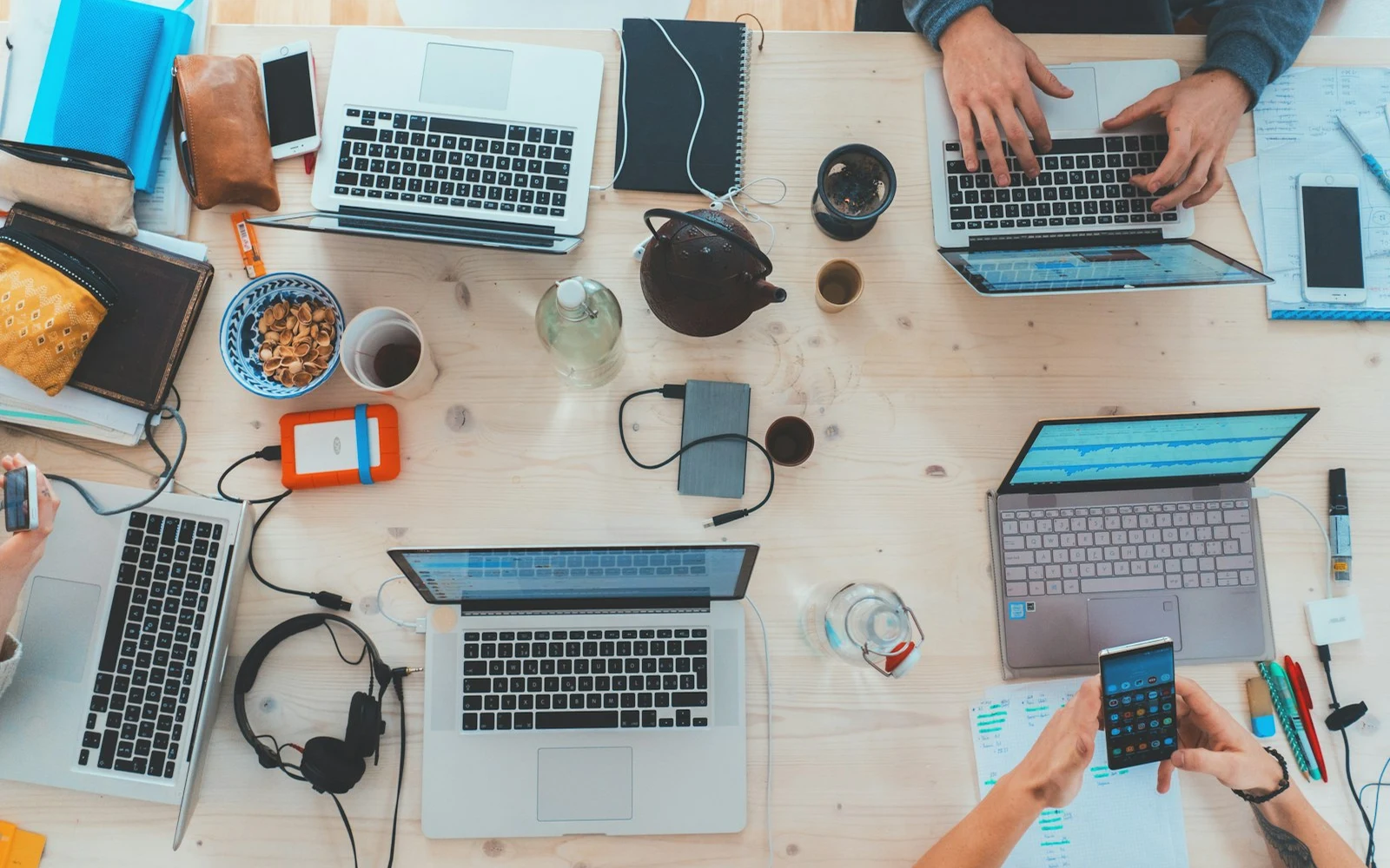 A team working through shared operational notes in a bright office
