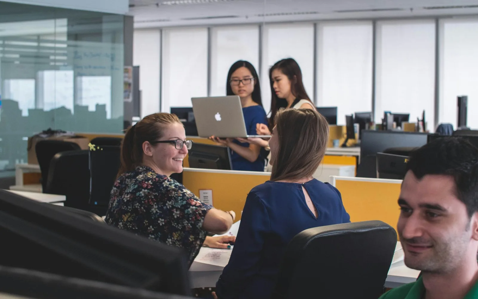 New colleagues being welcomed into a team workspace