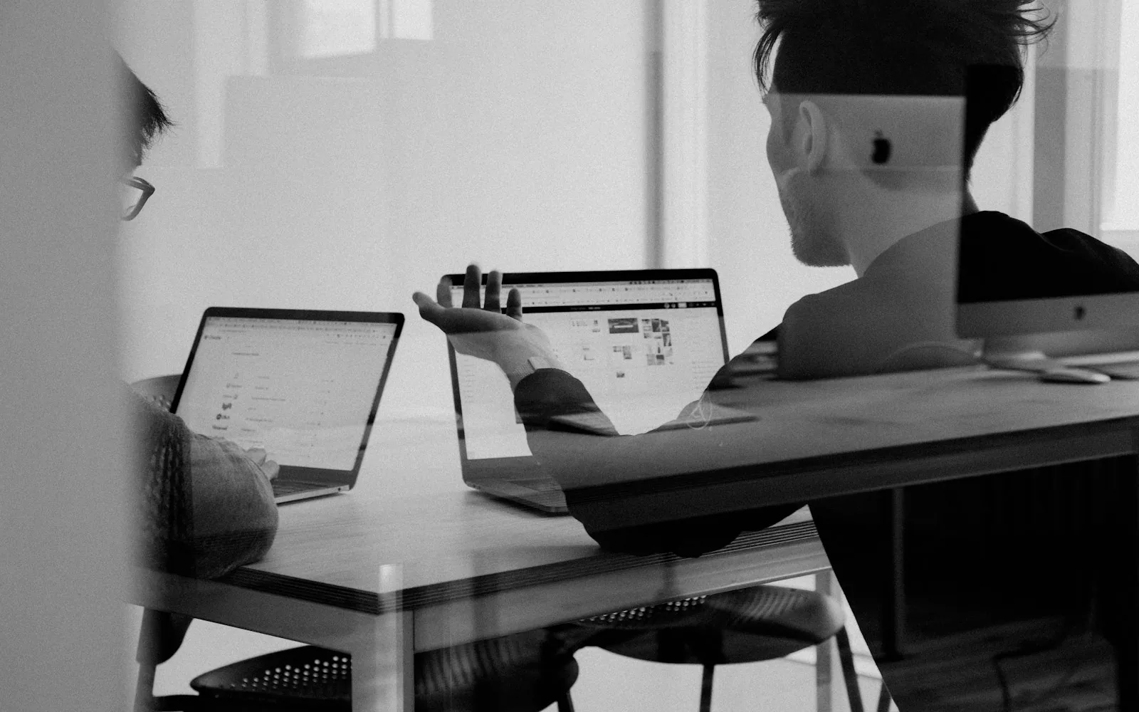 Team reviewing a shared hiring pipeline on a screen